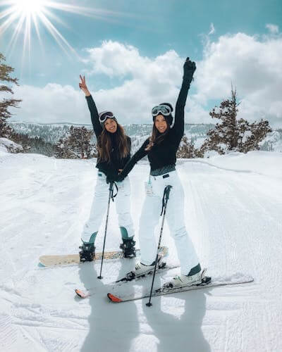 Two girls skiing