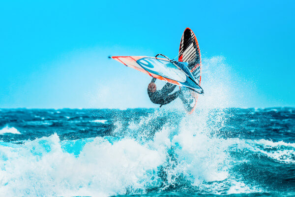 Wind surfer above a wave